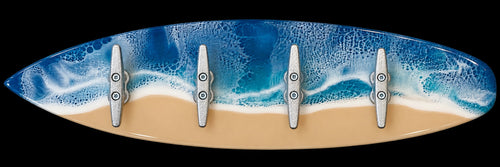 Inspired by Lyss surfboard wall hook rack with blue ocean resin waves and four metal nautical cleat hooks.